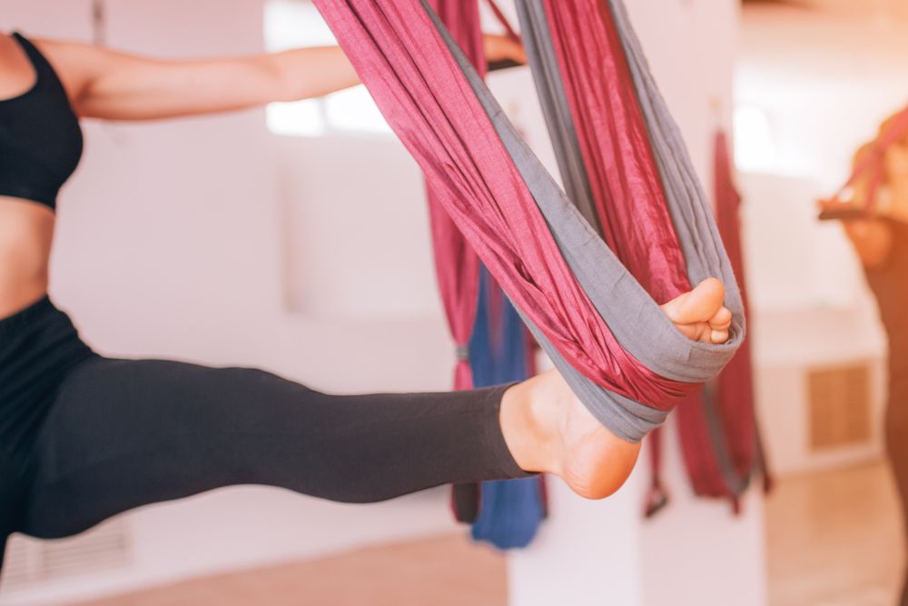 Aerial Yoga: Tips for Beginners, Health Benefits, Poses, and More